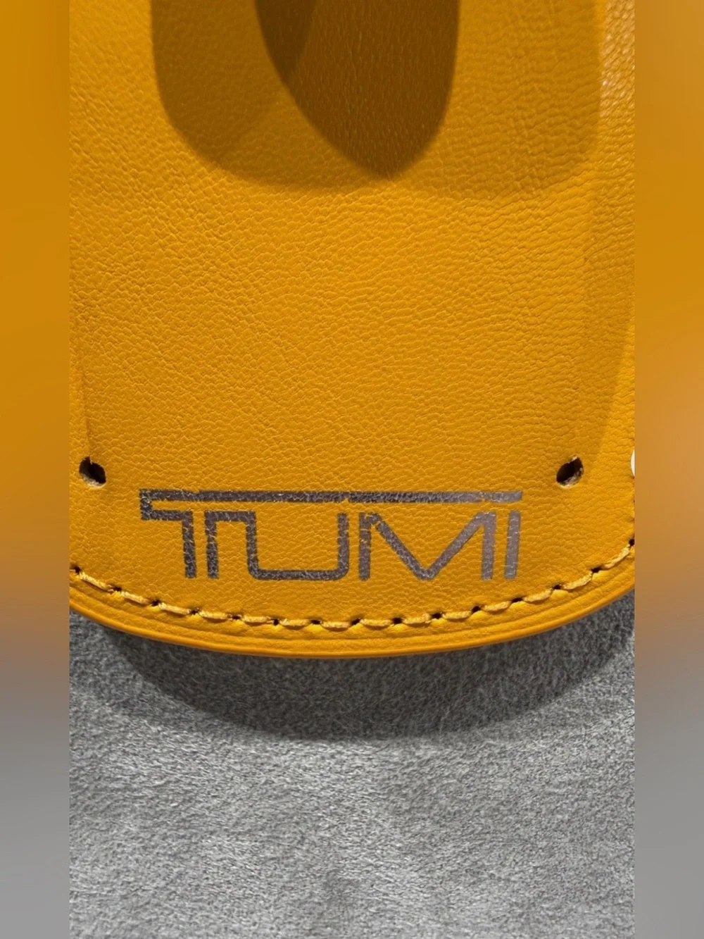 NEW IN BOX - Tumi 3.625” x 2.25” Leather Luggage Name Tag w/ Buckle - ORANGE